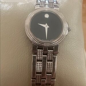 Movado stainless steel quartz watch.